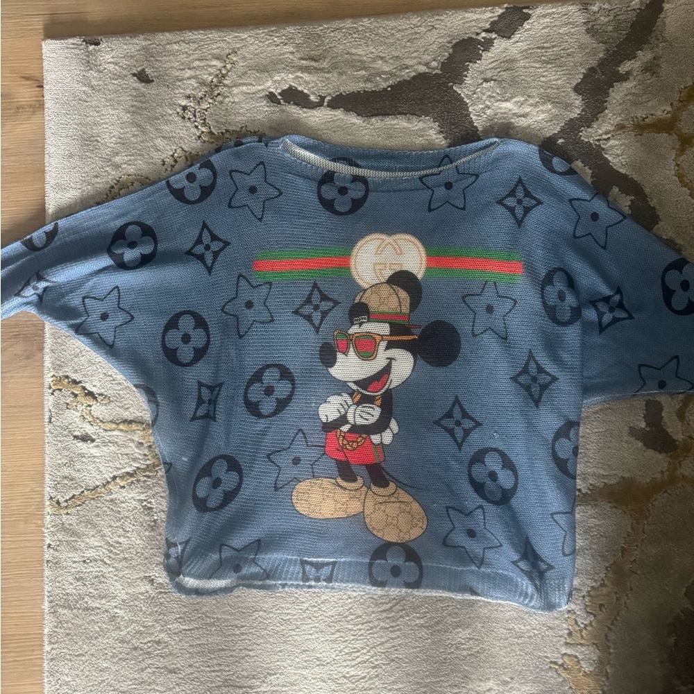Blue Sweater with Cartoon Graphic and Monogram Pattern